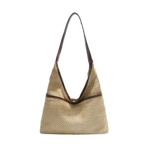 Minimalist straw tote bag with brown leather handles and large capacity summer design