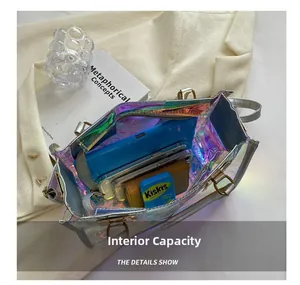 Spacious interior of holographic clear square bag showing phone and daily essentials