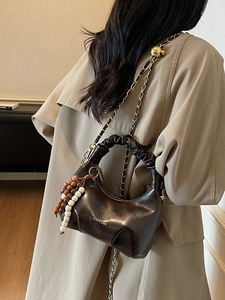 Dark brown pleated dumpling bag with beaded charm and chain strap for women