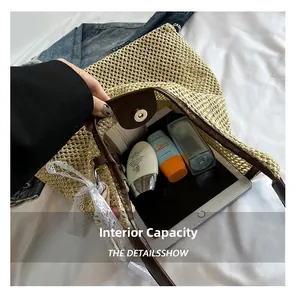 Detail view of woven straw tote bag interior showing large capacity for iPad and cosmetics
