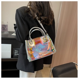 Detailed view of the holographic laser crossbody bag with metallic clasp and adjustable strap