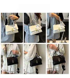 Detail view of woven texture crossbody bags in black and beige with silk scarf decor