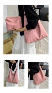Close-up of pink tote bag with lychee texture leather and matching zipper pouch