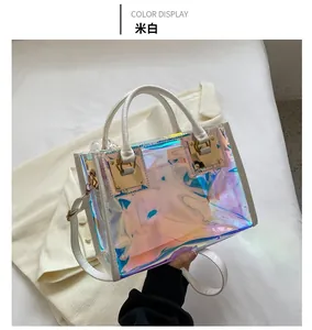 Detail of cream leather trim and laser holographic PVC on a small square tote bag