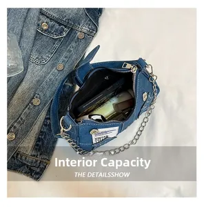 Top view of open star denim bag interior showing phone and cosmetics storage space
