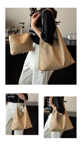 Detail of beige lychee pattern leather texture on large tote and matching pouch set