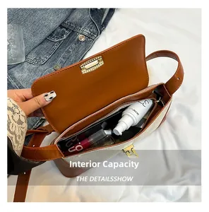 Macro view showing spacious interior of the baguette bag with makeup storage