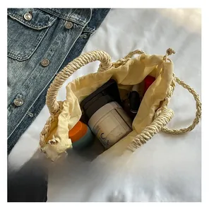 Internal view of handmade straw bag showing spacious interior with drawstring lining