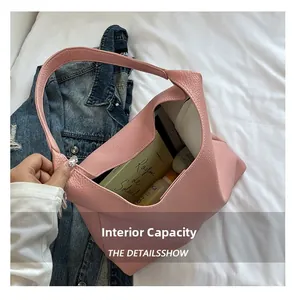 Pink lychee texture leather tote bag detail showing large capacity with daily essentials