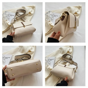 Détails du sac bandoulière en cuir crème avec sangle large et clous de protection dorés