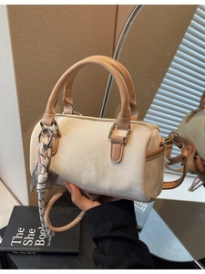 Retro cream mini Boston bag with brown leather handles and a woven rope charm detail