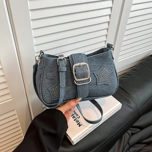 Chic Y2K denim shoulder bag with silver star rivets and adjustable strap