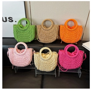 Handmade half-round straw handbags with round handles in six vibrant summer colors
