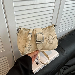 Beige star rivet shoulder bag with silver hardware for chic street style