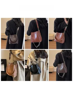 Detailed views of multi-color vintage leather bucket bags with stylish patterned wide straps