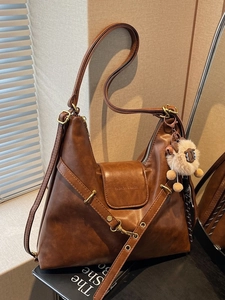Brown leather large capacity tote bag with adjustable shoulder strap and cute lamb charm