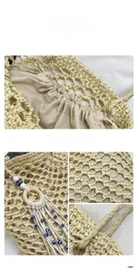 Detail of straw woven tote bag with hollow fishnet design and blue evil eye tassel charm