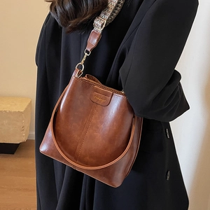 Retro dark brown bucket bag with vintage wide woven strap and gold hardware