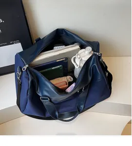 Spacious navy blue travel tote bag with organized interior storage for essentials