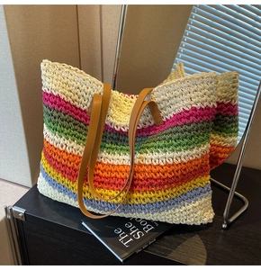 Detailed close-up of woven hollow texture on a colorful rainbow summer straw tote bag