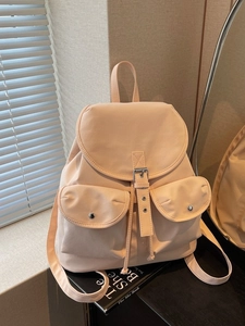 Fashionable blush pink nylon backpack for women with metal buckle flap and side drawstrings