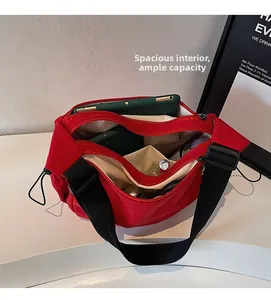 Macro view of the large capacity red canvas bag showing multiple inner storage compartments