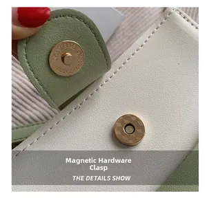 Macro detail of golden magnetic snap hardware on light green leather crossbody bag
