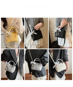 Mini crossbody bucket bag with pearl ribbon bow shown in four vibrant color options