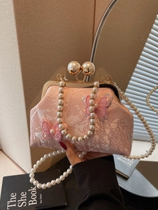Sac à main ethnique en jacquard rose avec poignée en perles et broderie papillon