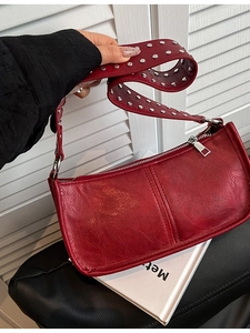 Vintage red leather shoulder bag with silver stud strap and minimalist rectangle design