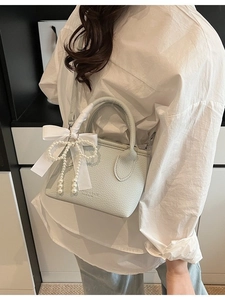 Chic light blue litchi leather mini bucket bag with pearl bow and silk ribbon charm
