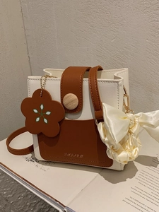 Mini bicolor shoulder bag in cream and brown with floral charm and silk scarf detail
