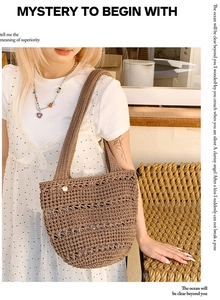 Detail of hollow woven structure and metal logo pendant on brown crochet shoulder bag