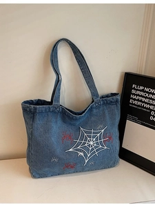 Retro gothic denim tote bag with blue spider web embroidery and large shoulder capacity