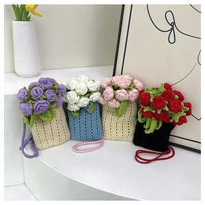 Collection of handmade crochet flower bucket bags in multiple colors with shoulder straps