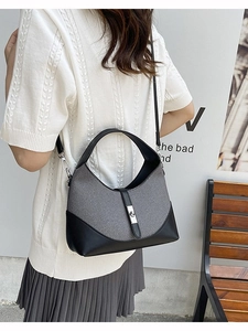 Chic two-tone gray and black hobo shoulder bag with metallic buckle closure