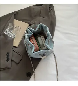 Top view of blue denim bucket bag interior showing spacious storage for essentials
