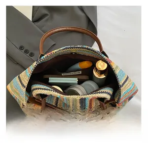Top view of woven tote interior showing spacious storage and multi-colored striped pattern