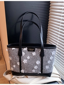 Grey tweed tote bag with 3D white floral appliques and black leather trim accents
