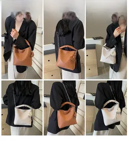 Multiple views of a woven hobo bag with chain strap and heart charm worn by a model