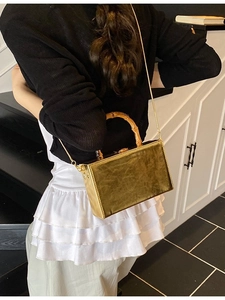 Elegant olive gold crossbody bag with bamboo handle and gold chain shoulder strap
