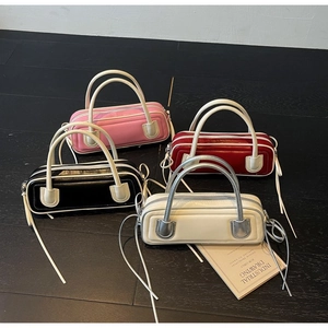 Minimalist barrel-shaped leather handbag set in pink, burgundy, black, and beige colors
