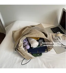 Detail view of khaki crossbody bag interior showing spacious storage for daily essentials