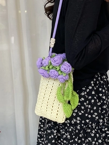 Exquisite handmade crochet bucket bag with 3D purple flower and green leaf decorations