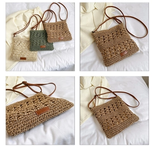 Detail view of woven straw crossbody bags in three colors with fine crochet pattern