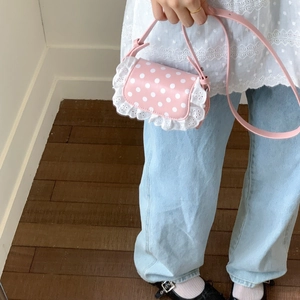Pink polka dot crossbody bag with white lace trim and adjustable shoulder strap for girls