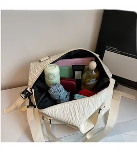 Interior view showing large capacity storage for tablet and umbrella in white canvas tote