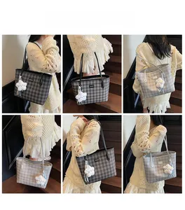 Detailed views of grey plaid tote bag with plush star charm on shoulder strap