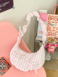 Pink striped dumpling shoulder bag with bow details and ruched strap for women
