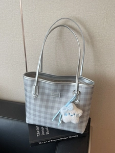Silver grey plaid tote bag with metallic finish and plush star charm on minimalist shoulder strap